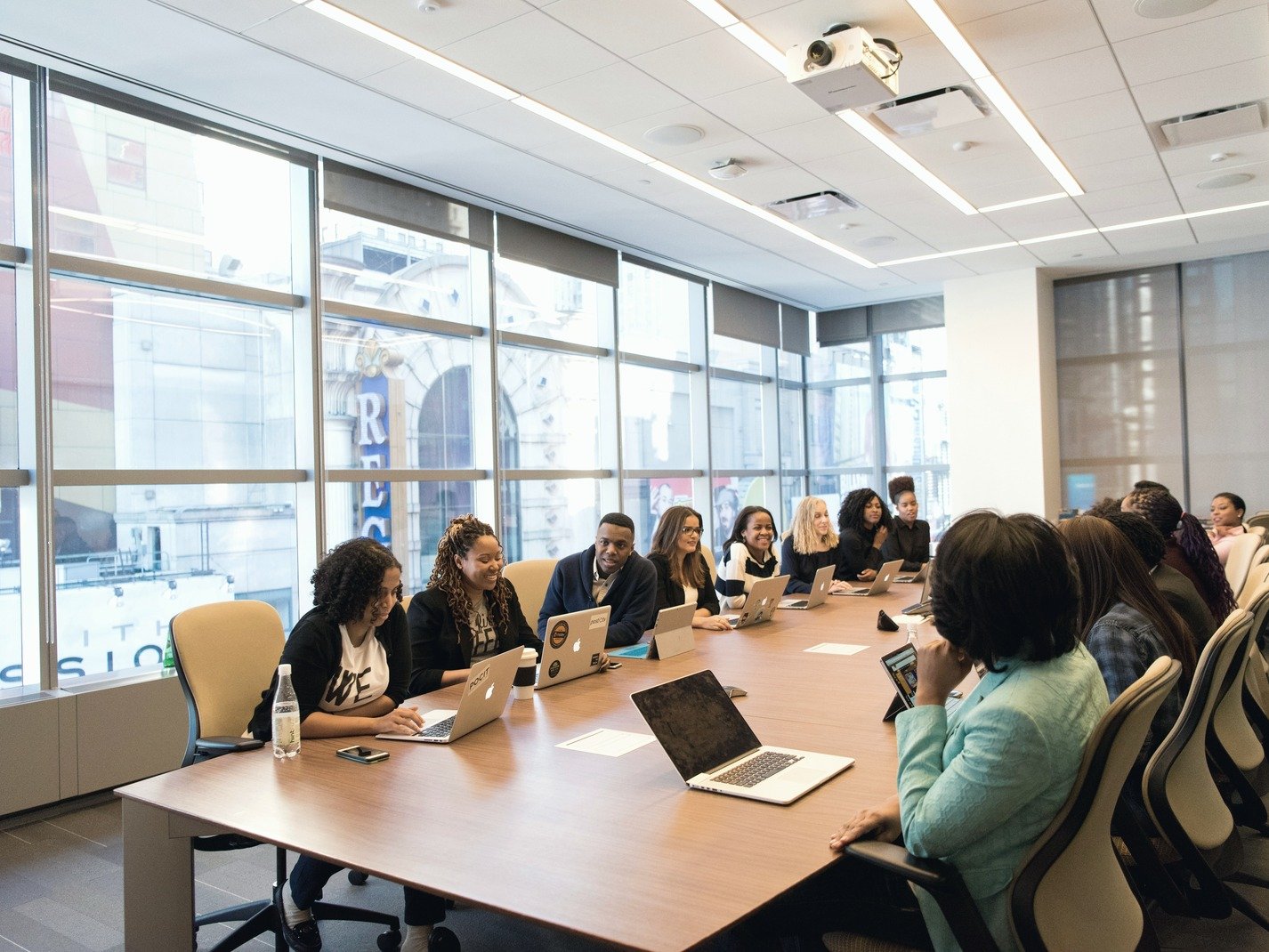 A diverse group in a boardroom assessment meeting